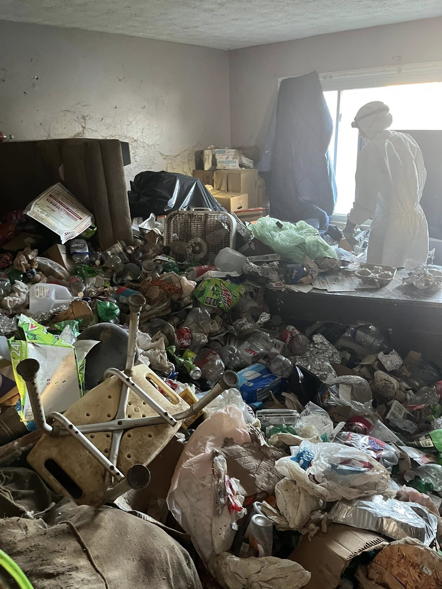 hoarding cleanout room full of garbage